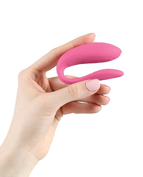 A small, U-shaped vibrator designed to be worn during sex. The vibrator is a light purple color and features two small arms that wrap around the clitoris and G-spot. The toy is adjustable to fit any body shape and connects to the We-Connect app for remote control.