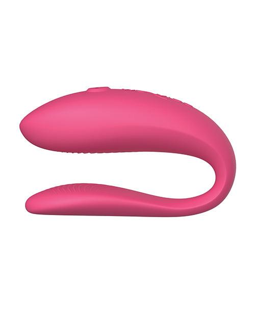 A small, U-shaped vibrator designed to be worn during sex. The vibrator is a light purple color and features two small arms that wrap around the clitoris and G-spot. The toy is adjustable to fit any body shape and connects to the We-Connect app for remote control.