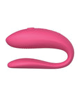 A small, U-shaped vibrator designed to be worn during sex. The vibrator is a light purple color and features two small arms that wrap around the clitoris and G-spot. The toy is adjustable to fit any body shape and connects to the We-Connect app for remote control.