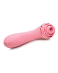 A pink silicone vibrator designed to look like a rose with green leaves. The base of the vibrator features a small button for controlling the vibration patterns and speeds. The vibrator also features a suction cup for hands-free pleasure.