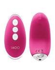 A small, wireless vibrator in a light pink color. The vibrator is designed to fit seamlessly into a pair of panties for discreet pleasure. The front of the vibrator features a small button for controlling the vibration patterns and speeds. Pink