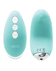 A small, wireless vibrator in a light pink color. The vibrator is designed to fit seamlessly into a pair of panties for discreet pleasure. The front of the vibrator features a small button for controlling the vibration patterns and speeds. Turquoise