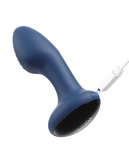 Blue Frenzy Rotating Butt Plug held in hand, demonstrating its medium size and ergonomic shape.