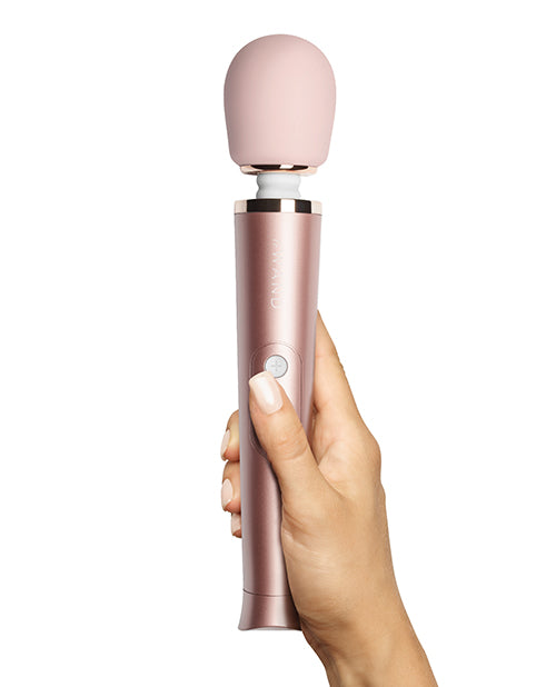 Le Wand Petite Rechargeable Vibrating Massager being held in hand
