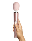 Le Wand Petite Rechargeable Vibrating Massager being held in hand