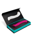 Hand holding a waterproof G-spot vibrator, perfect for bath or shower use.