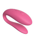 A small, U-shaped vibrator designed to be worn during sex. The vibrator is a light purple color and features two small arms that wrap around the clitoris and G-spot. The toy is adjustable to fit any body shape and connects to the We-Connect app for remote control.