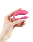 A small, U-shaped vibrator designed to be worn during sex. The vibrator is a light purple color and features two small arms that wrap around the clitoris and G-spot. The toy is adjustable to fit any body shape and connects to the We-Connect app for remote control.